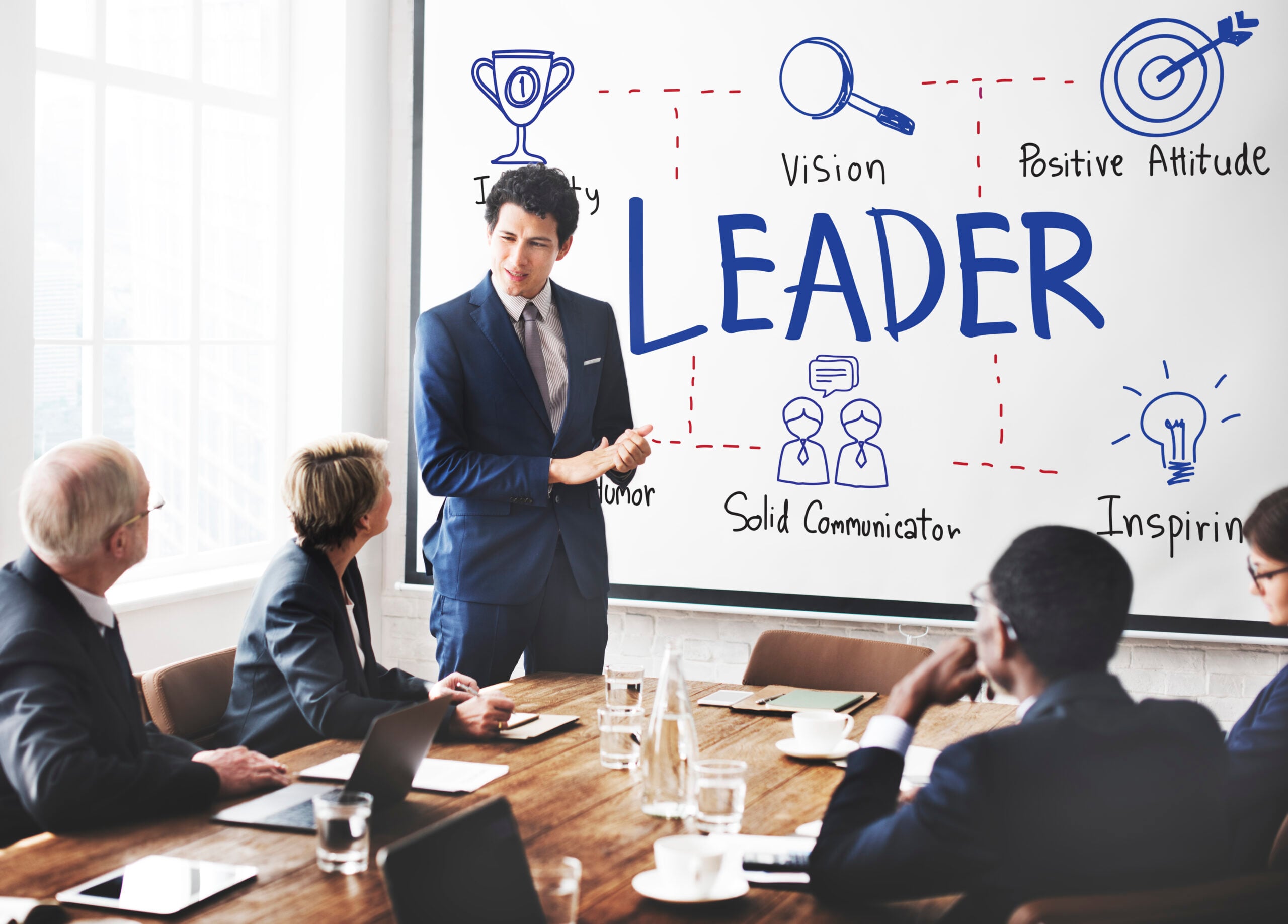 Empowered business leader presenting strategies in a corporate meeting for effective team management.